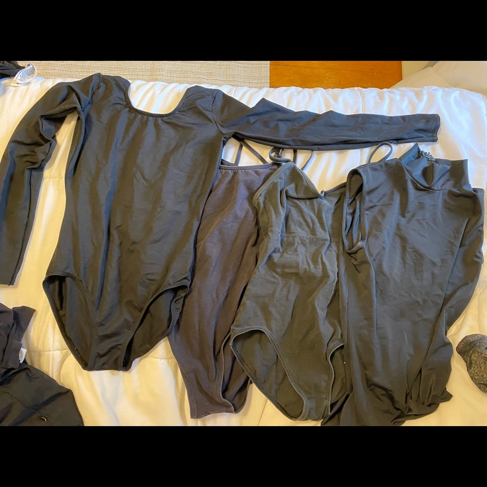 lot of four black dance leotards